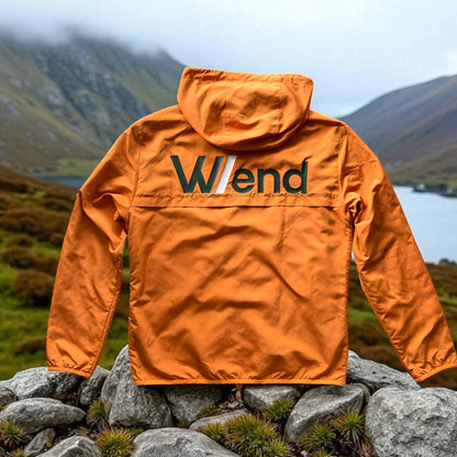 W/end Windbreaker Hot Ember Jacket with a logo on a mountainous landscape