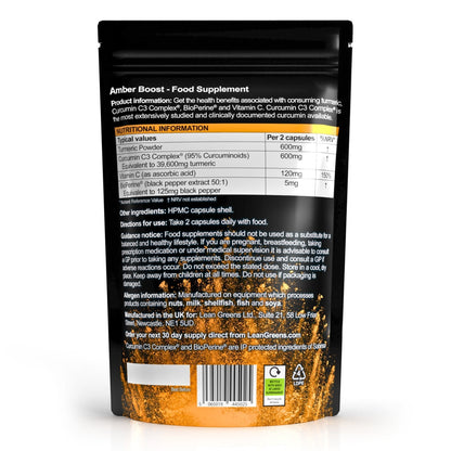 W/end Amber Boost turmeric and curcumin supplement capsules with black pepper and vitamin C. Dietary supplement.