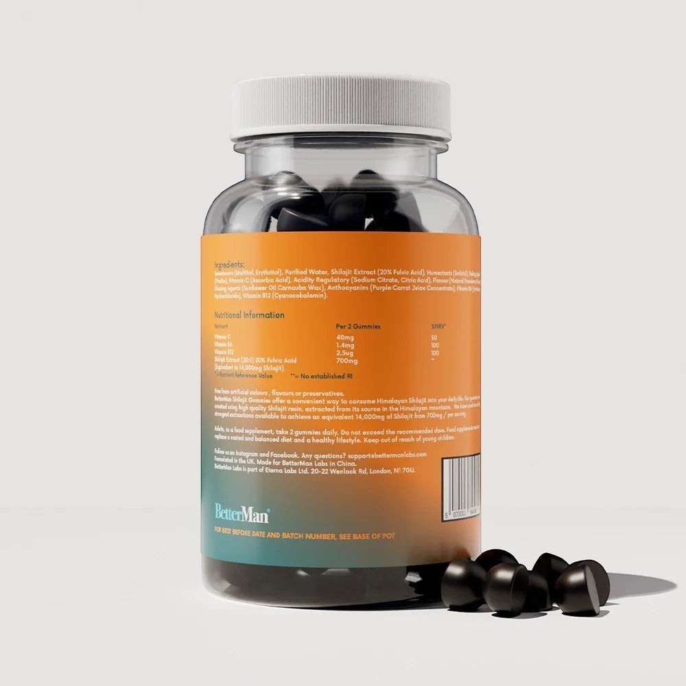 W/end BetterMan Labs Forest Berry Shilajit Gummies bottle with loose gummies. Contains vitamins B12, B6, and C.
