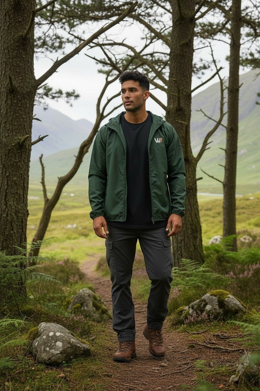 W/end forest green lightweight windbreaker jacket with zip fastening and hood, designed for outdoor movement.