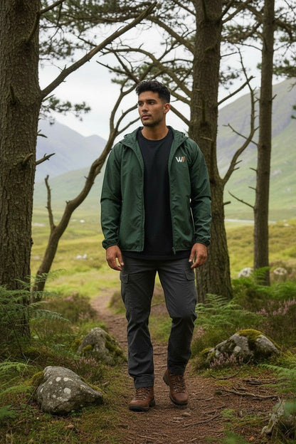 W/end forest green lightweight windbreaker jacket with zip fastening and hood, designed for outdoor movement.