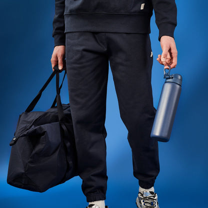 W/end navy blue 1L stainless steel thermal water bottle with flip lid, perfect for travel and workouts.